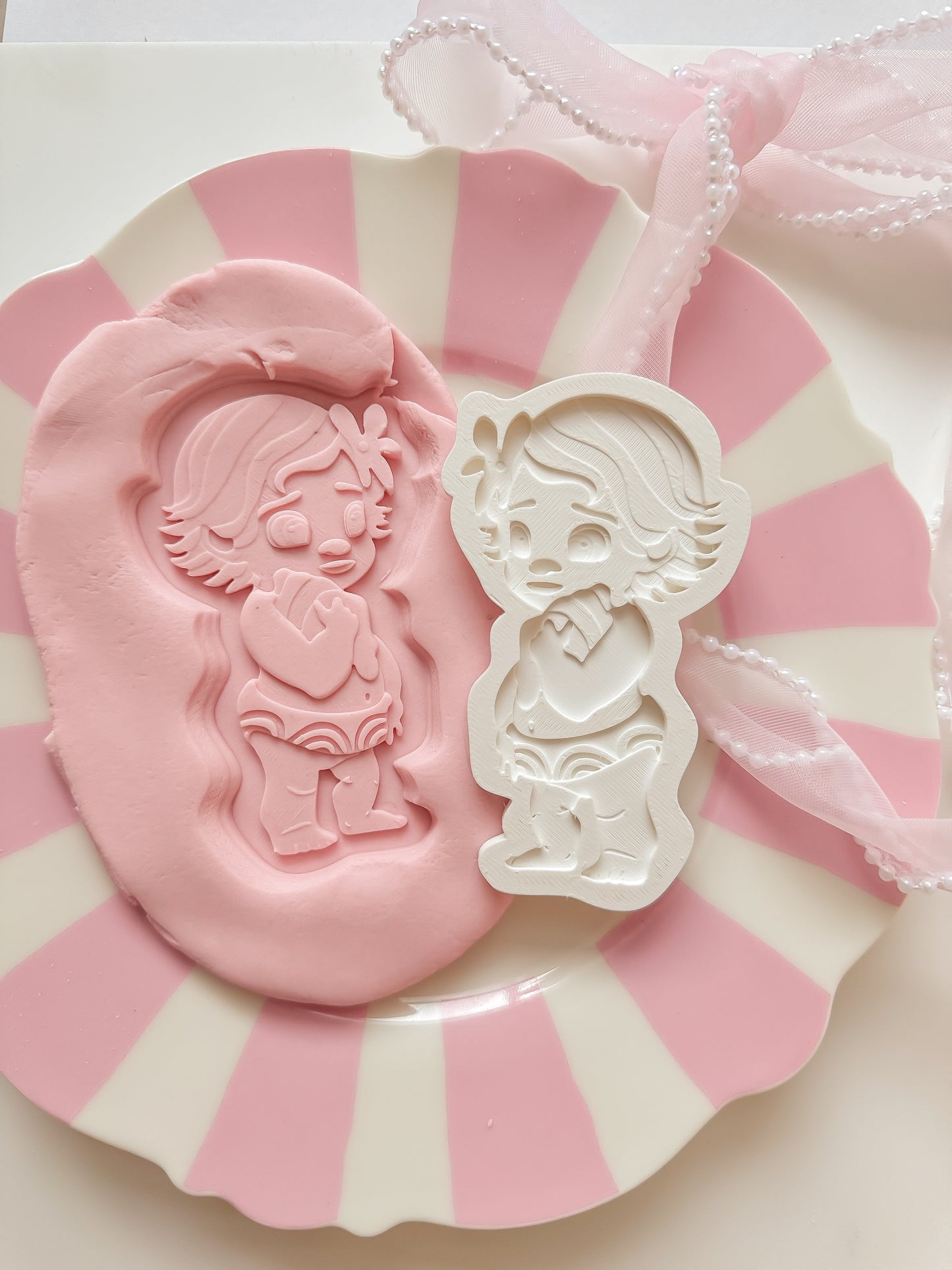 Baby Island girl holding shell - Debosser and Cutter