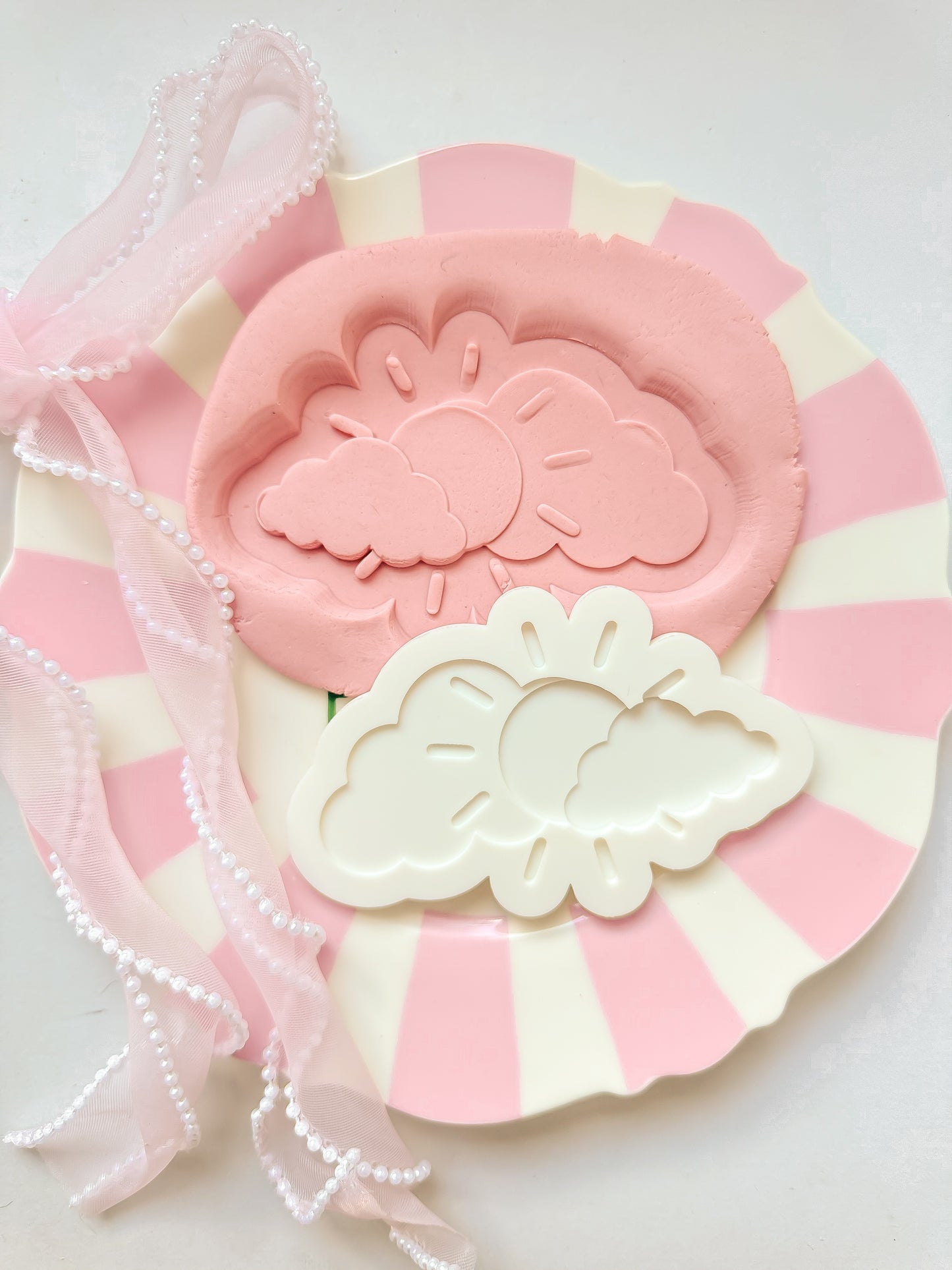 Sun and clouds - Debosser and Cutter